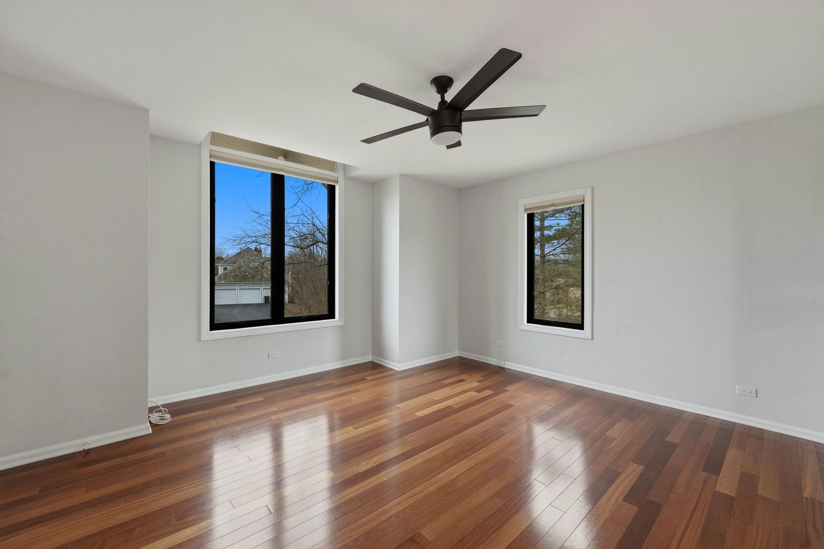 5212 Briarcrest Lane Long Grove, IL 60047 - Photo 33 of 50 a view of a big room with wooden floor and windows