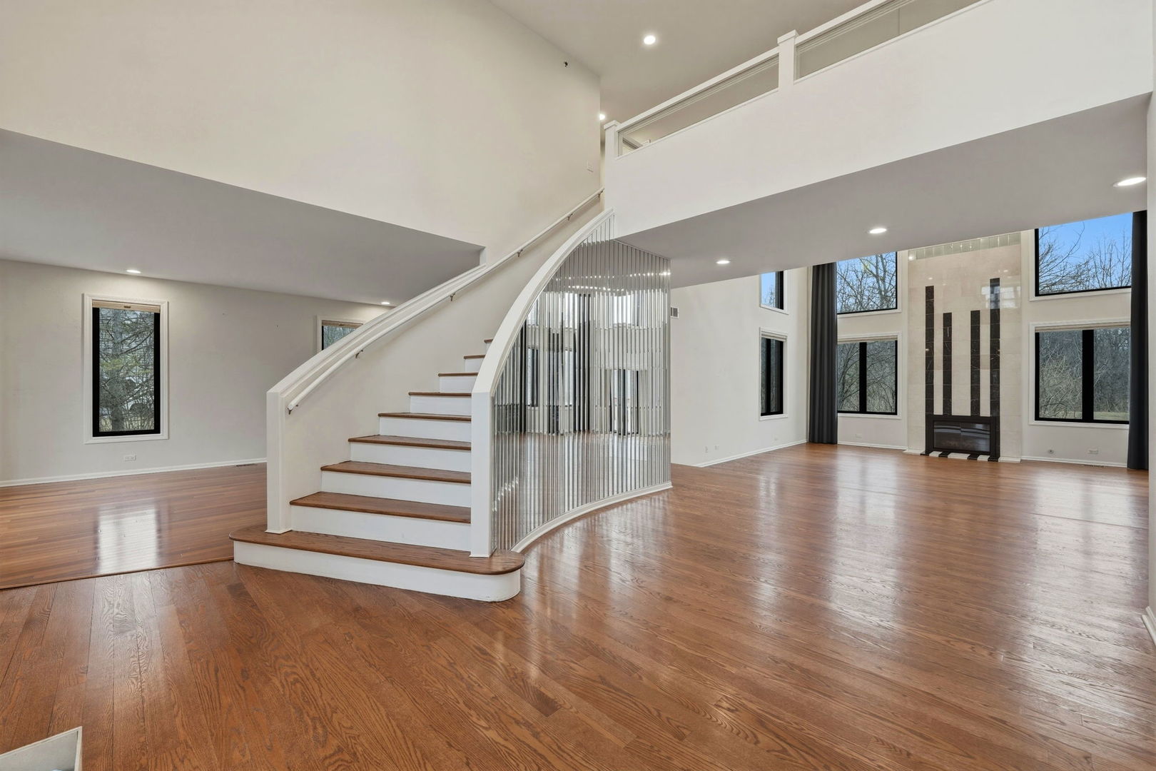 5212 Briarcrest Lane Long Grove, IL 60047 - Photo 4 of 50 a view of a hall with wooden floor and stairs