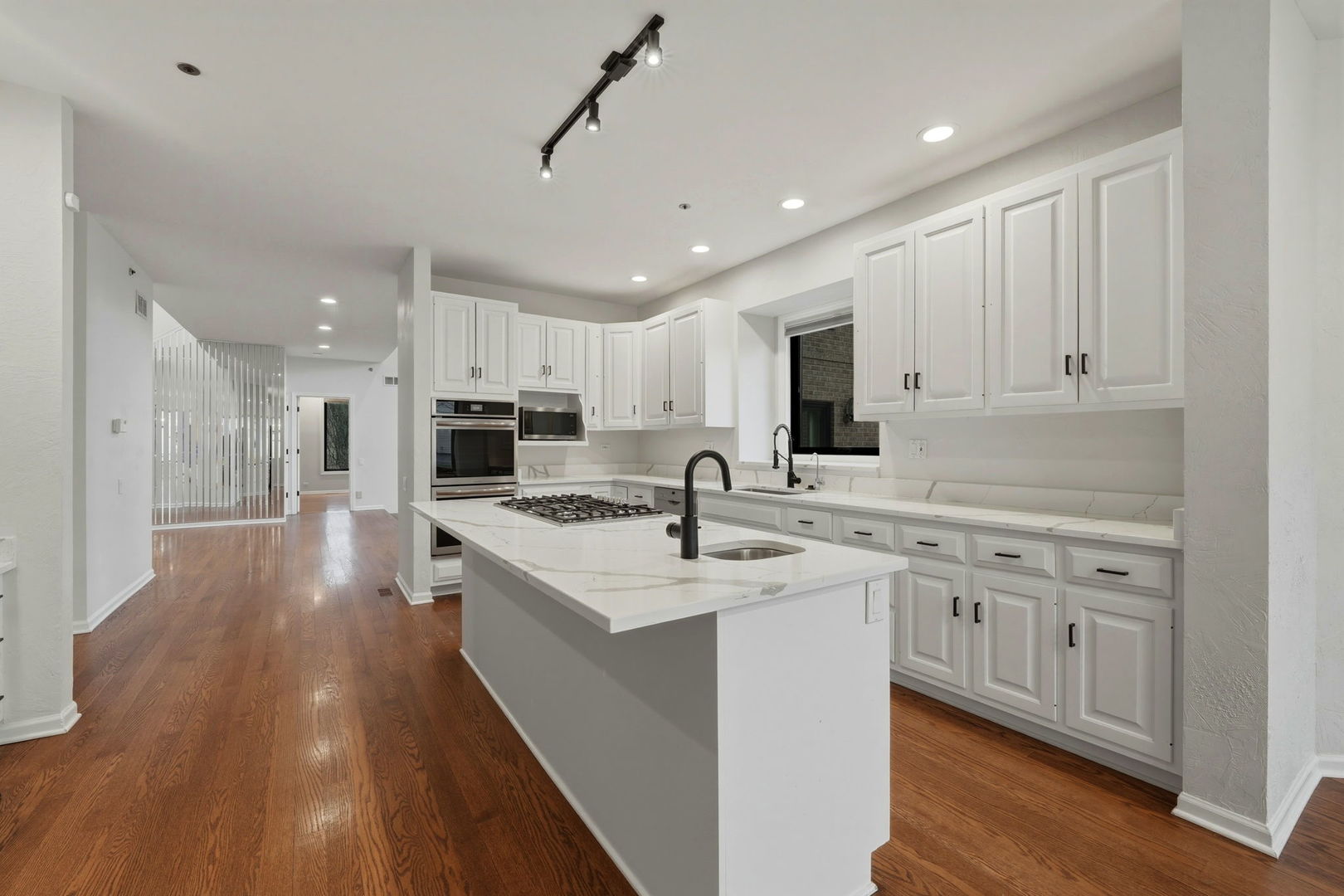 5212 Briarcrest Lane Long Grove, IL 60047 - Photo 10 of 50 a kitchen with stainless steel appliances kitchen island granite countertop a sink and cabinets
