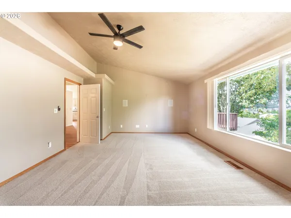 a view of an empty room with a window