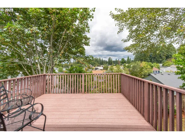 a view of balcony with wooden floor
