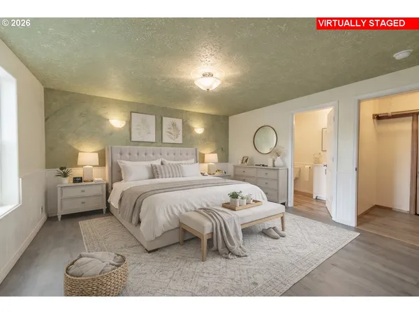 a view of an empty room and wooden floor