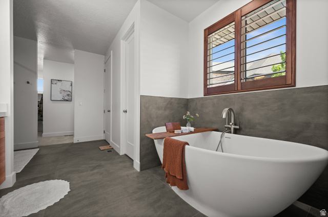507 West Windmill Gate Cove Draper, UT 84020 - Photo 25 of 46 Full bathroom featuring a freestanding tub and vanity
