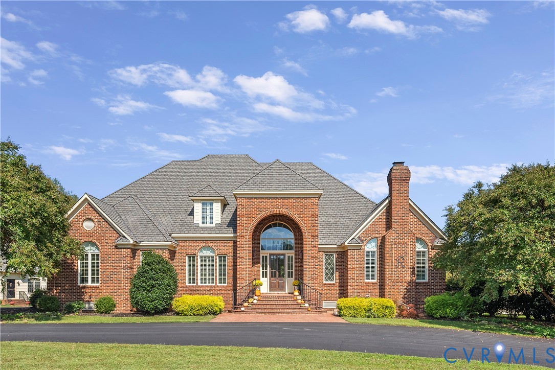 2110 Hawk Town Road Maidens, VA 23102 - Photo 1 of 50 a front view of a house with a garden