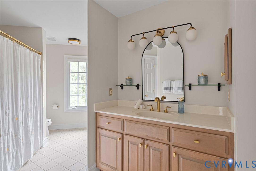 2110 Hawk Town Road Maidens, VA 23102 - Photo 28 of 50 a bathroom with a double vanity sink mirror and shower