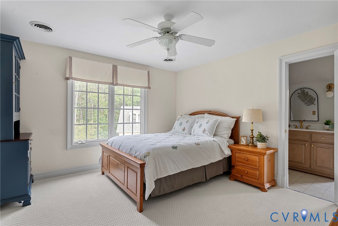 2110 Hawk Town Road Maidens, VA 23102 - Photo 29 of 50 a spacious bedroom with a bed and a dresser