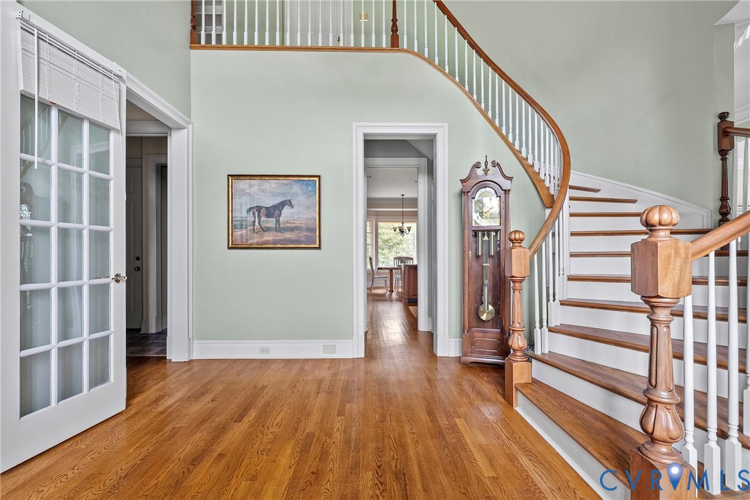 2110 Hawk Town Road Maidens, VA 23102 - Photo 4 of 50 a view of a hallway with wooden floor and stairs