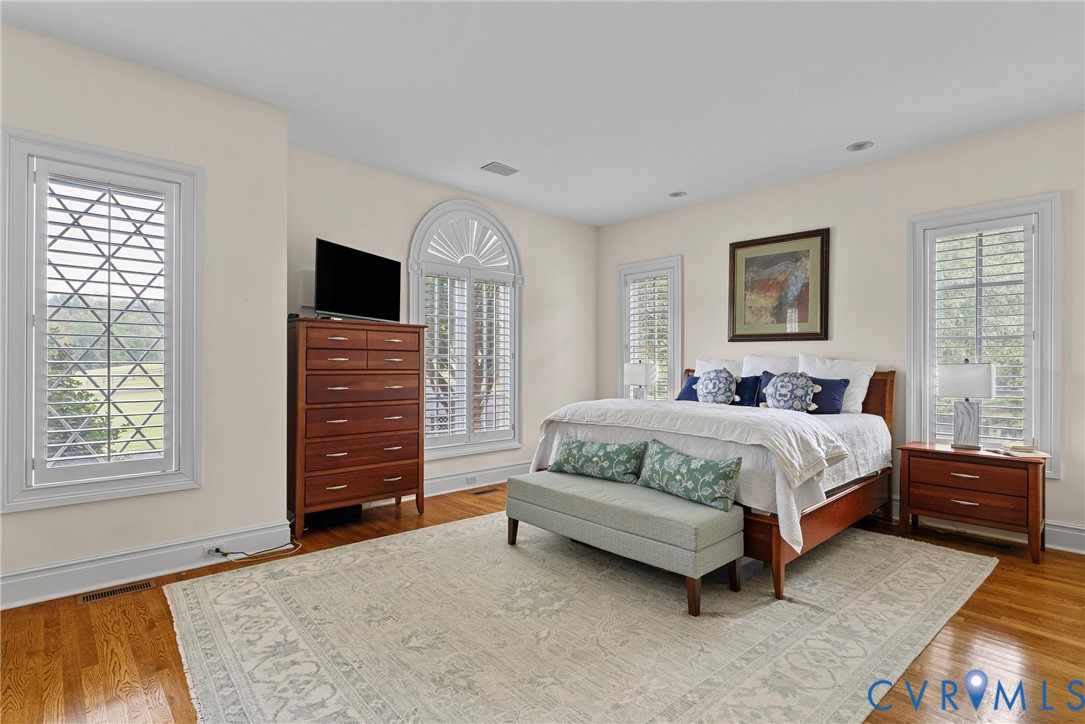 2110 Hawk Town Road Maidens, VA 23102 - Photo 5 of 50 a spacious bedroom with a bed and wooden floor