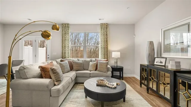 a living room with furniture and a table