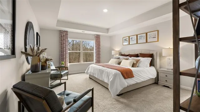 a bedroom with bed and a large window