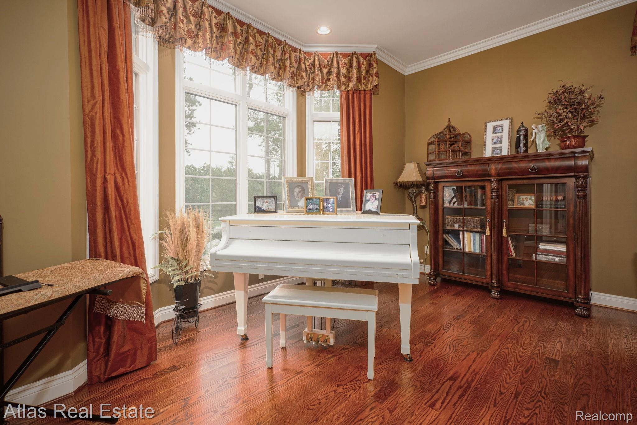 10380 South State Road Goodrich, MI 48438 - Photo 27 of 87 Rich hardwood flooring complemented by a bay window with ample natural light