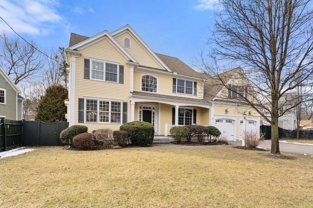 a front view of a house with a yard