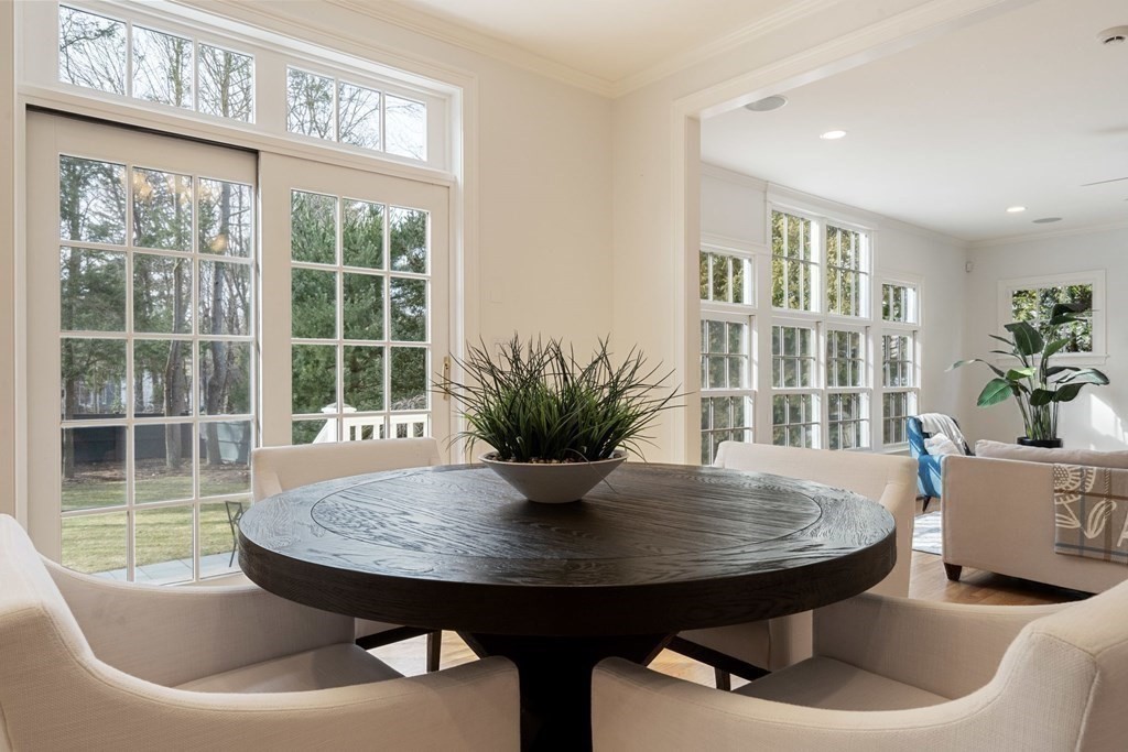 51 Baker Place Newton, MA 02462 - Photo 12 of 38 a view of a dining room with furniture window and wooden floor