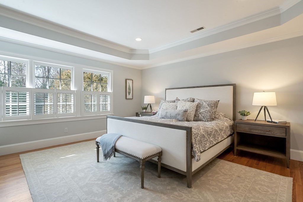 51 Baker Place Newton, MA 02462 - Photo 21 of 38 a spacious bedroom with a bed and a window