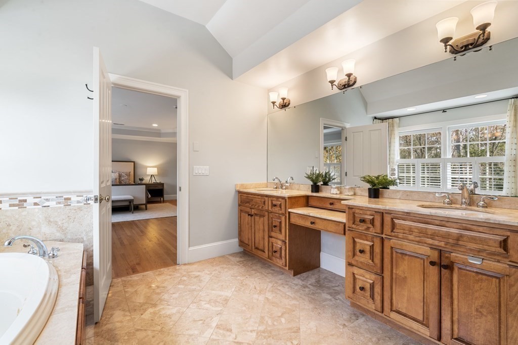 51 Baker Place Newton, MA 02462 - Photo 22 of 38 a large kitchen with kitchen island a sink stainless steel appliances and cabinets