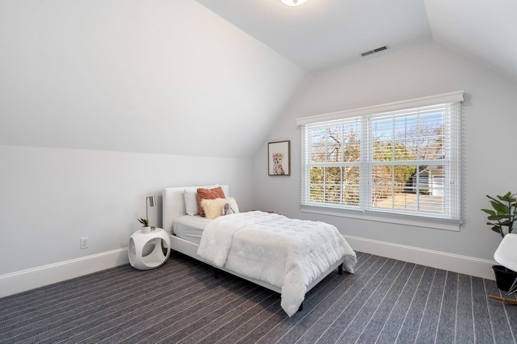 51 Baker Place Newton, MA 02462 - Photo 29 of 38 a bedroom with a bed and a window
