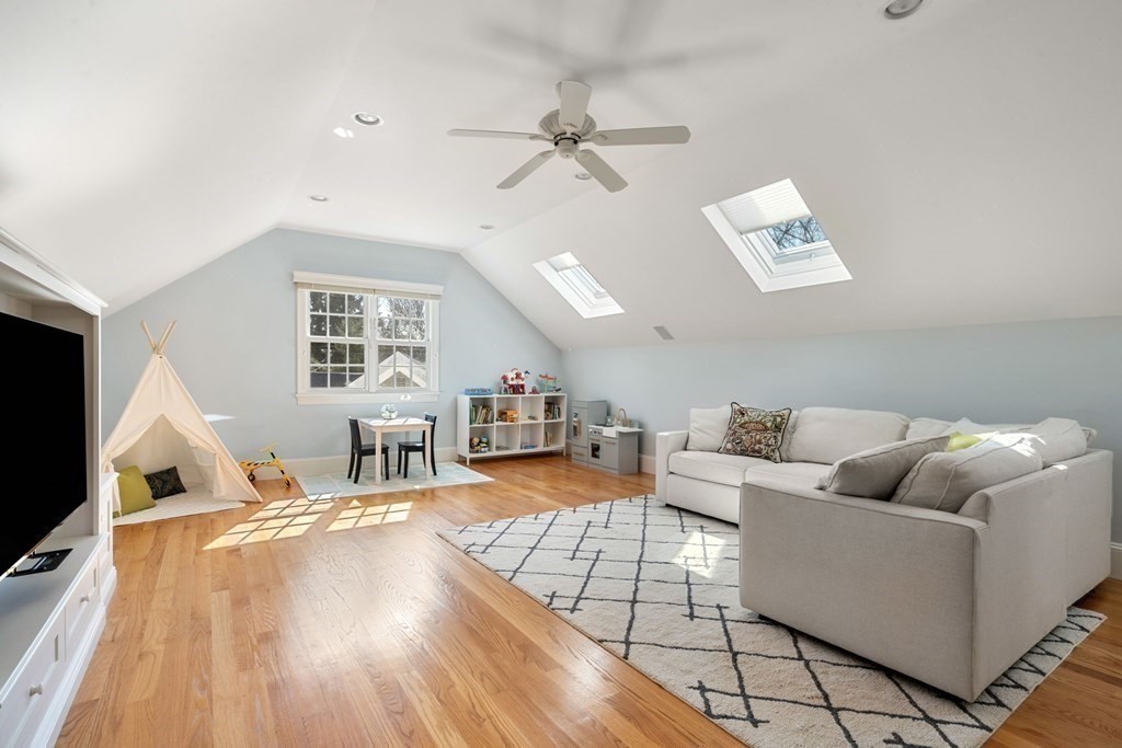51 Baker Place Newton, MA 02462 - Photo 31 of 38 a living room with furniture and a flat screen tv
