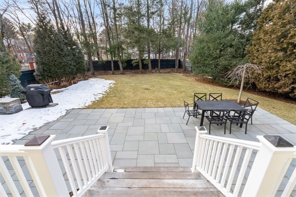 51 Baker Place Newton, MA 02462 - Photo 33 of 38 a view of a patio with a table and chairs