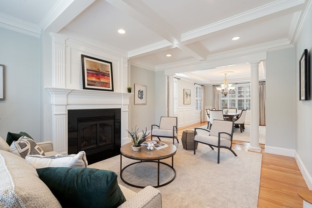 51 Baker Place Newton, MA 02462 - Photo 5 of 38 a living room with furniture and a fireplace