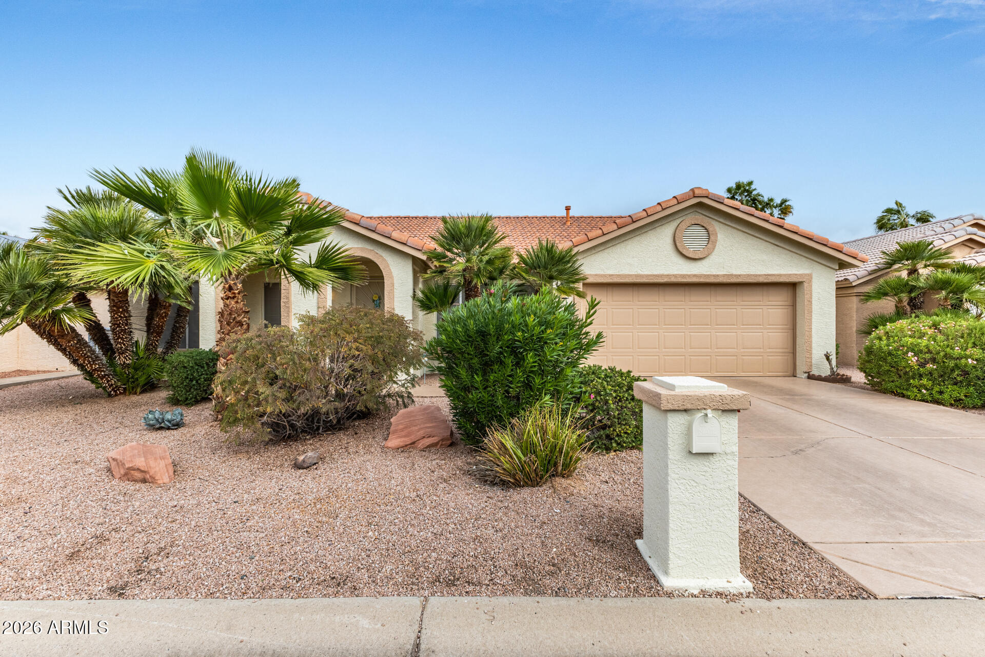 15764 Piccadilly Road Goodyear, AZ 85395 - Photo 2 of 31 a front view of a house with a yard and garage