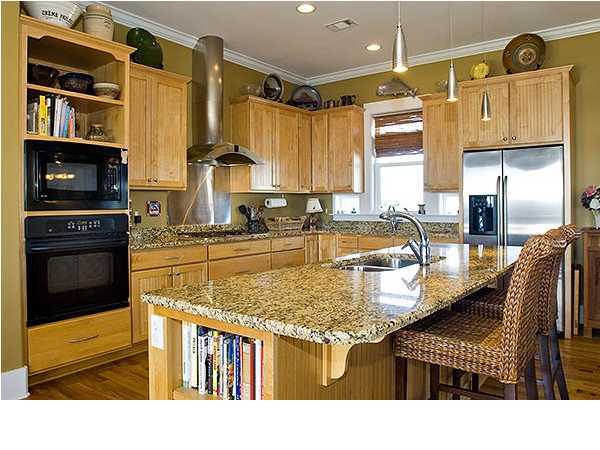 135 Sand Dunes Road Santa Rosa Beach, FL 32459 - Photo 6 of 19 a kitchen with stainless steel appliances granite countertop a sink and cabinets