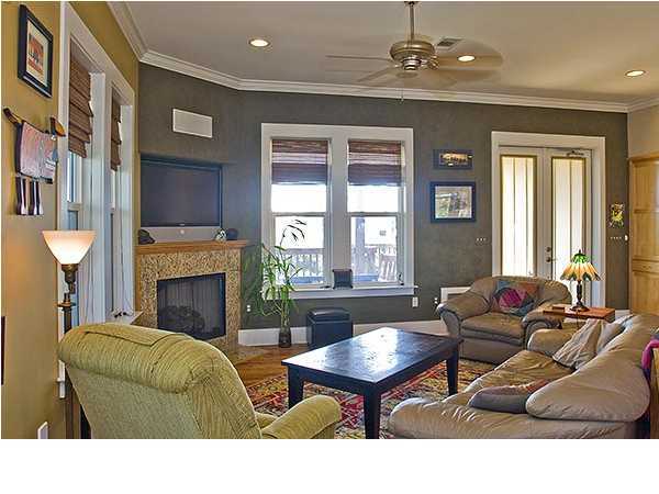 135 Sand Dunes Road Santa Rosa Beach, FL 32459 - Photo 8 of 19 a living room with furniture a fireplace and a chandelier