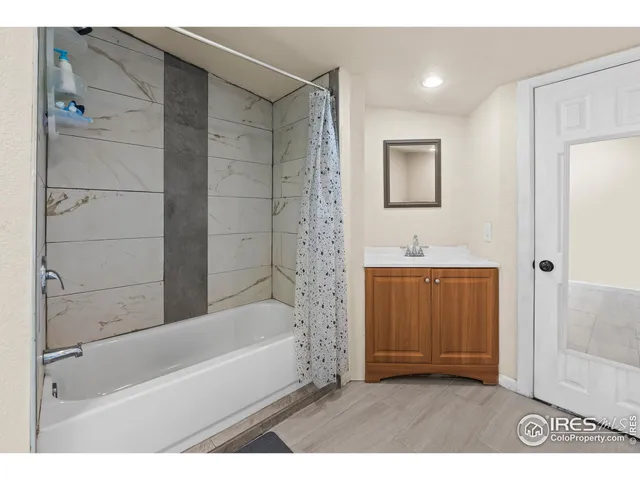 a bathroom with a bathtub and a sink