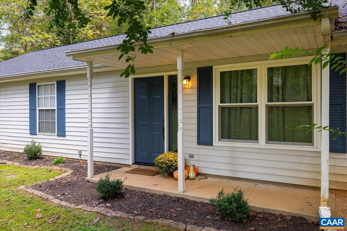1003 West Daffodil Road Ruckersville, VA 22968 - Photo 3 of 26 a front view of a house with garden