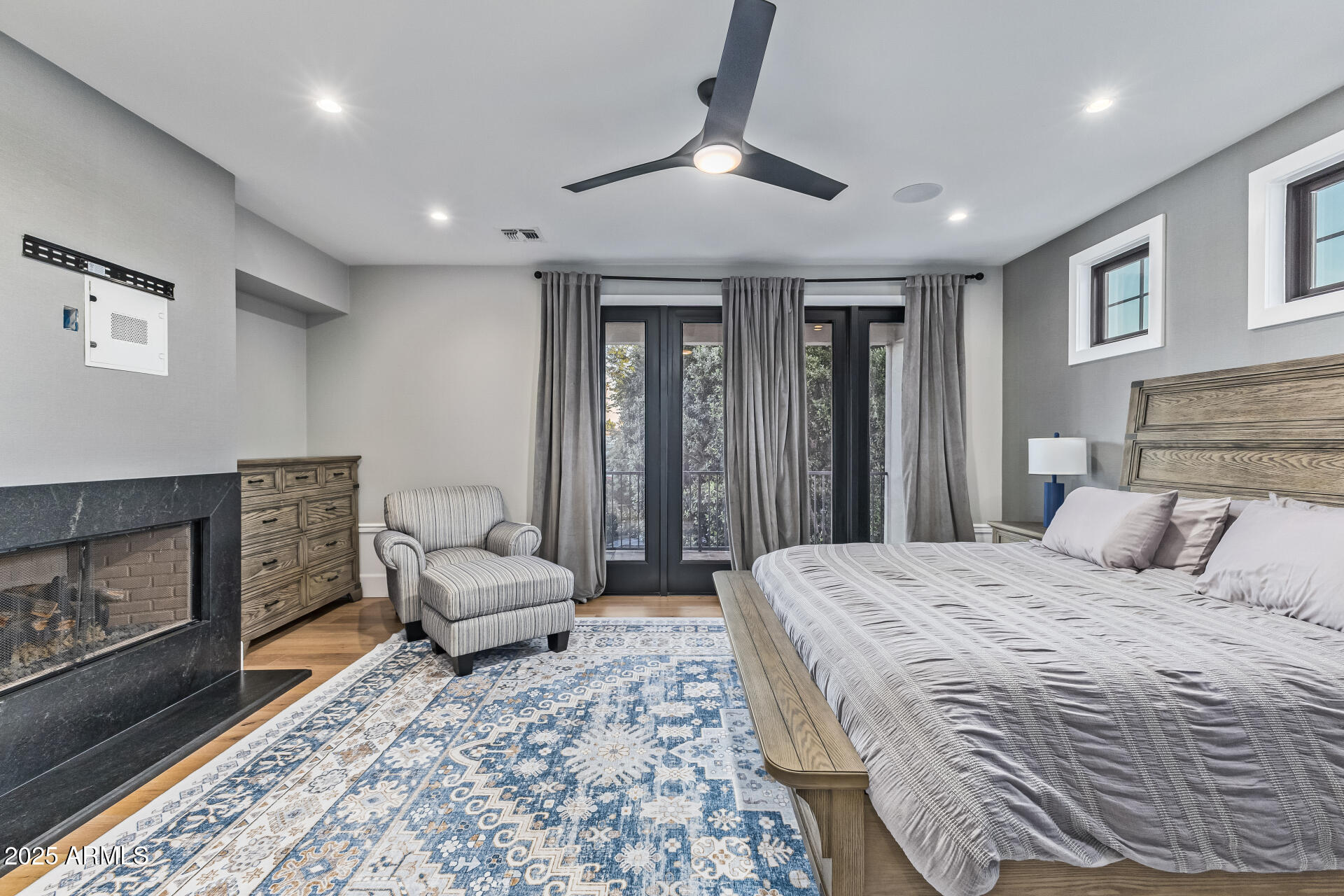 3810 East Campbell Avenue Phoenix, AZ 85018 - Photo 11 of 41 a bedroom with a bed and a fireplace