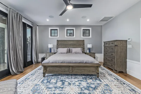 a bedroom with a bed and a fireplace