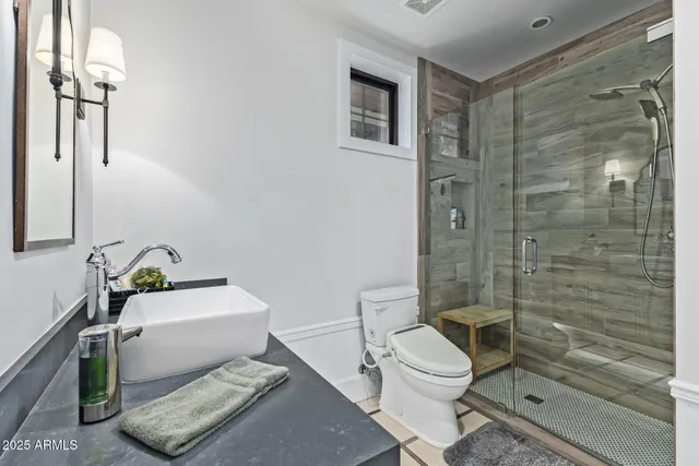 a bedroom with a bed and a view of bedroom