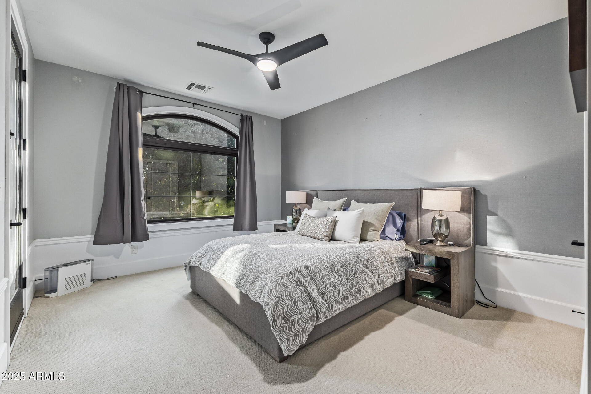 3810 East Campbell Avenue Phoenix, AZ 85018 - Photo 21 of 41 a bedroom with a large bed and a chandelier