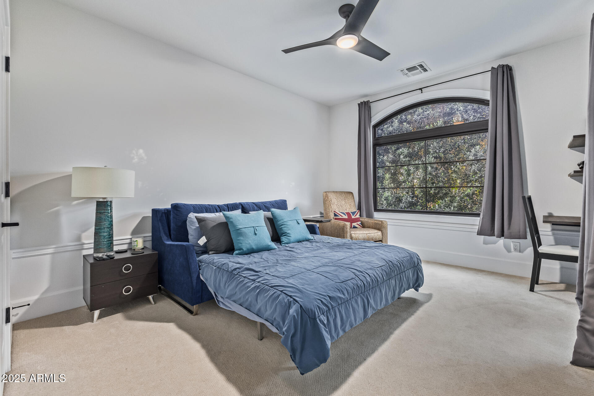 3810 East Campbell Avenue Phoenix, AZ 85018 - Photo 23 of 41 a spacious bedroom with a large bed and a window