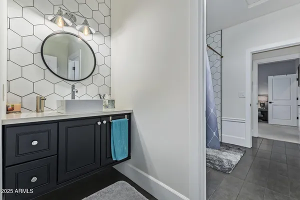 a spacious bedroom with a large bed and a window