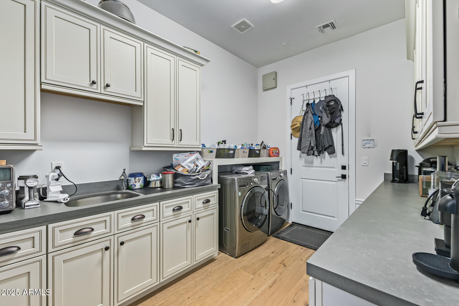 3810 East Campbell Avenue Phoenix, AZ 85018 - Photo 27 of 41 a kitchen with stainless steel appliances granite countertop a sink dishwasher stove and refrigerator