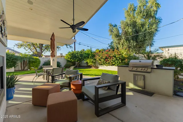 a kitchen with stainless steel appliances granite countertop a sink dishwasher stove and refrigerator