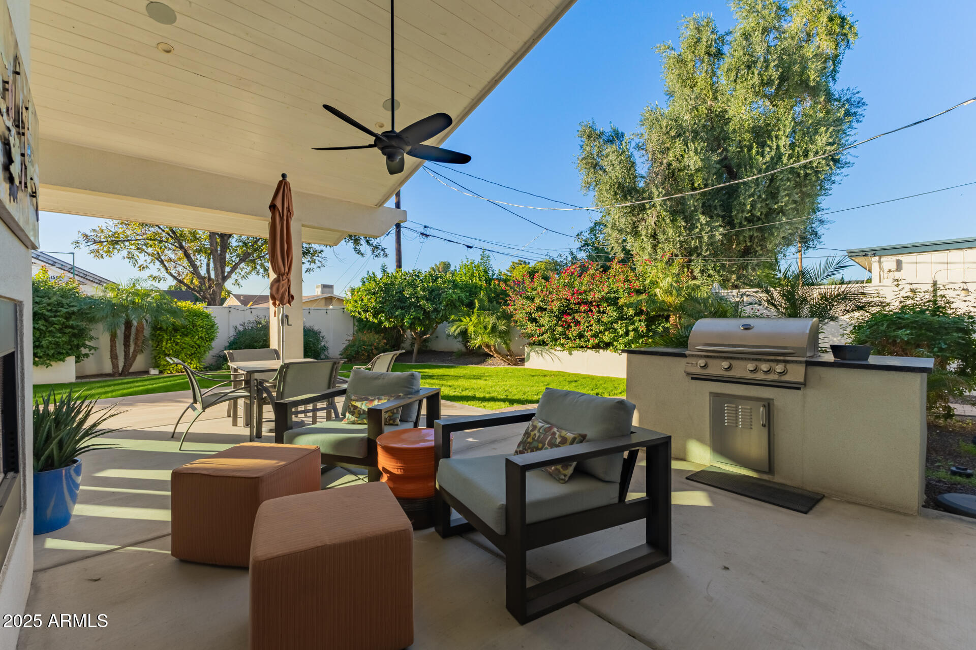 3810 East Campbell Avenue Phoenix, AZ 85018 - Photo 28 of 41 a view of a chairs and table in the back yard of the house