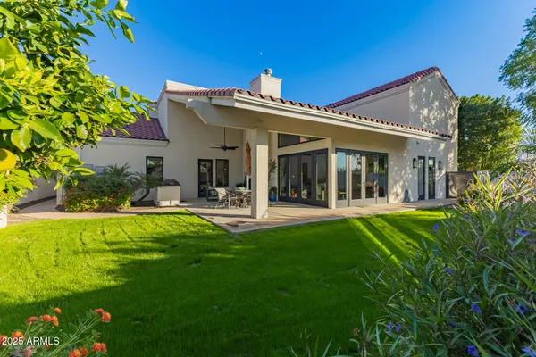 a view of swimming pool with a patio