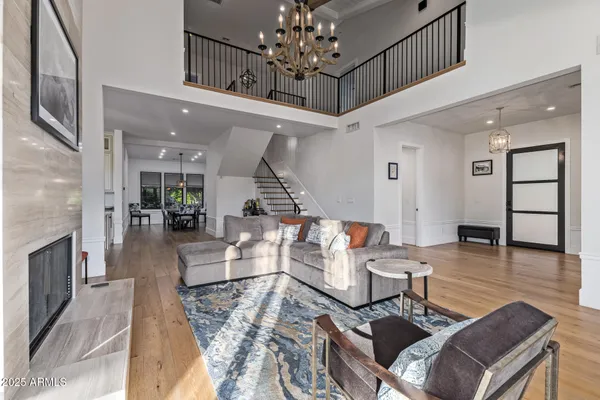 a living room with furniture and large windows