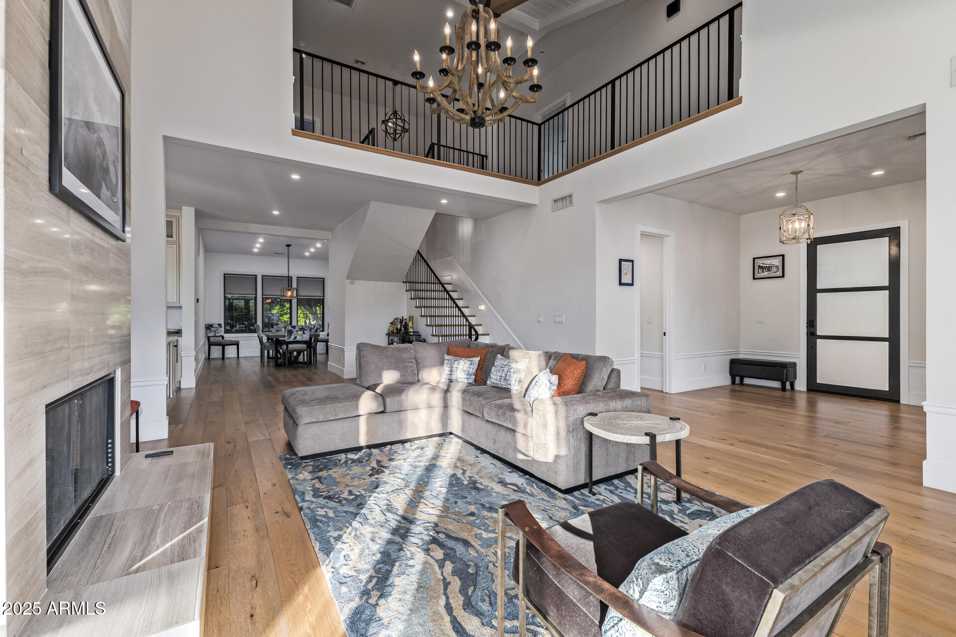 3810 East Campbell Avenue Phoenix, AZ 85018 - Photo 36 of 41 a living room with furniture and a chandelier