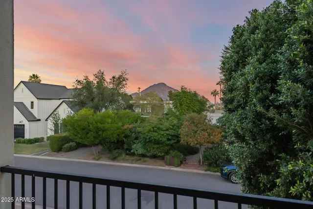 a view of a living room with furniture and wooden floor