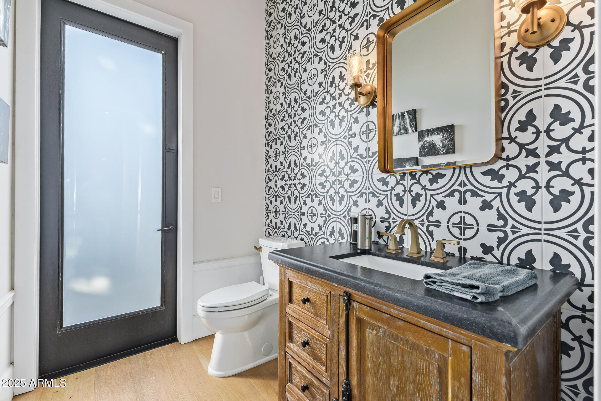 3810 East Campbell Avenue Phoenix, AZ 85018 - Photo 9 of 41 a bathroom with a granite countertop toilet and a sink