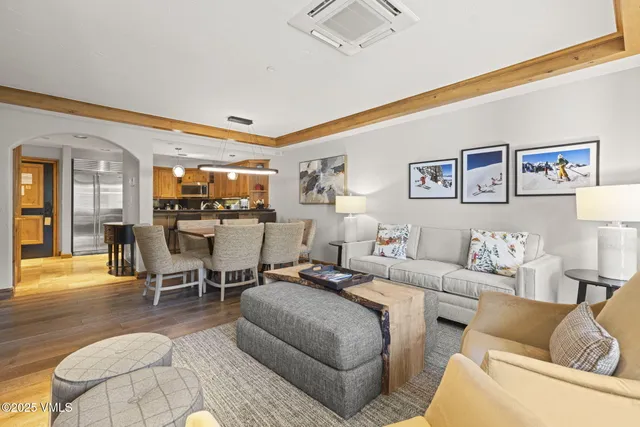 a living room with furniture and a rug