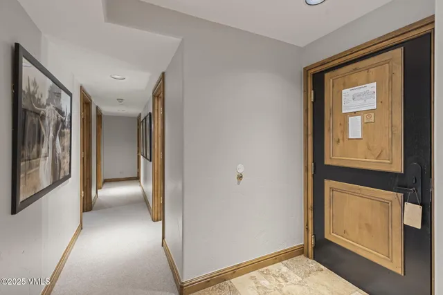 a view of a hallway with seating area