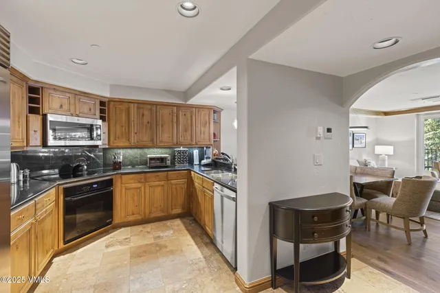 a bathroom with a double vanity sink toilet and a mirror