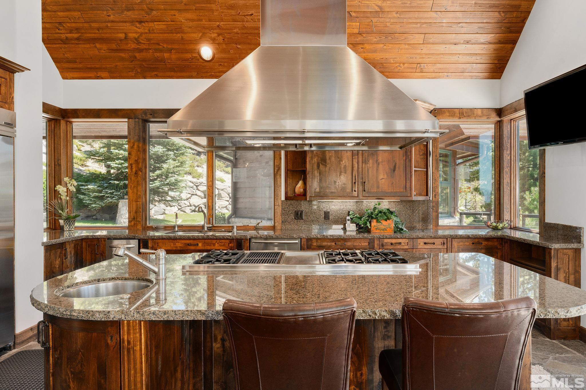 797 Ida Court Incline Village, NV 89451 - Photo 14 of 39 a kitchen with stainless steel appliances granite countertop a sink a stove and a wooden cabinets