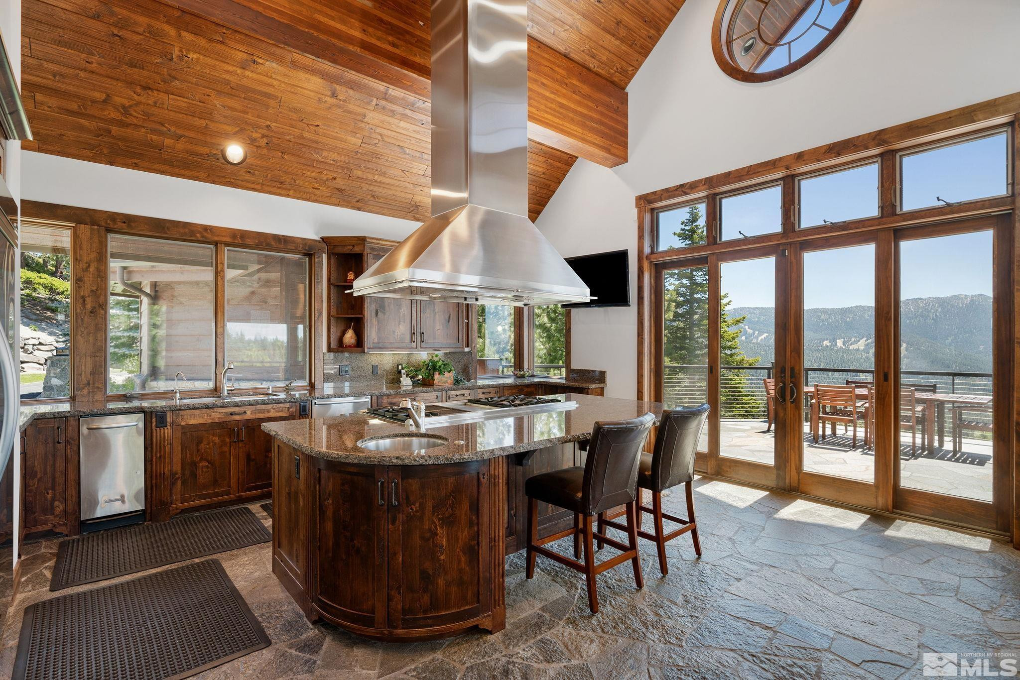 797 Ida Court Incline Village, NV 89451 - Photo 15 of 39 a view of a dining room with furniture large windows and wooden floor