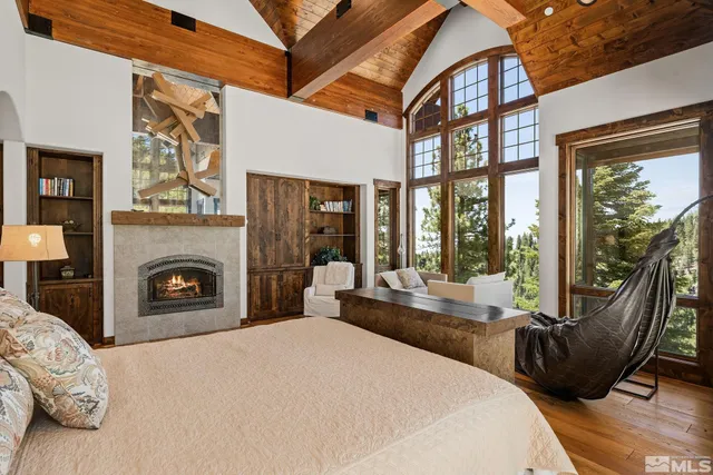 a bedroom with furniture and a fireplace