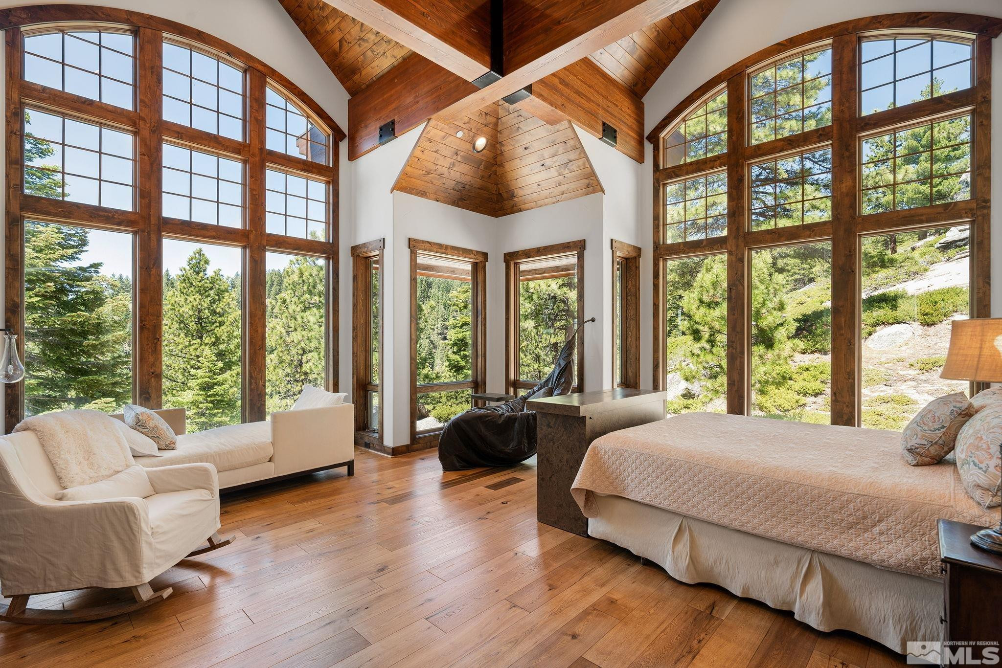 797 Ida Court Incline Village, NV 89451 - Photo 20 of 39 a spacious bedroom with a bed and a large window