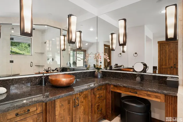 a kitchen with stainless steel appliances granite countertop a sink stove and cabinets